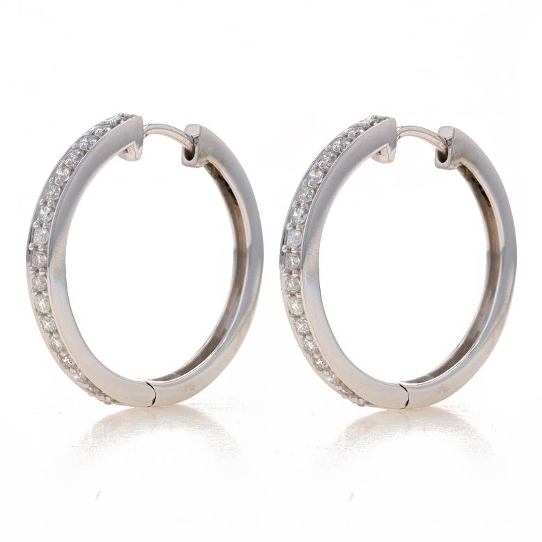 Metal Content: 14k White Gold

Stone Information
Natural Diamonds
Carat(s): .50ctw
Cut: Round Brilliant
Color: G - H
Clarity: SI2 - I1

Total Carats: .50ctw

Style: Hoop
Fastening Type: Snap Closures

Measurements
Tall: 7/8