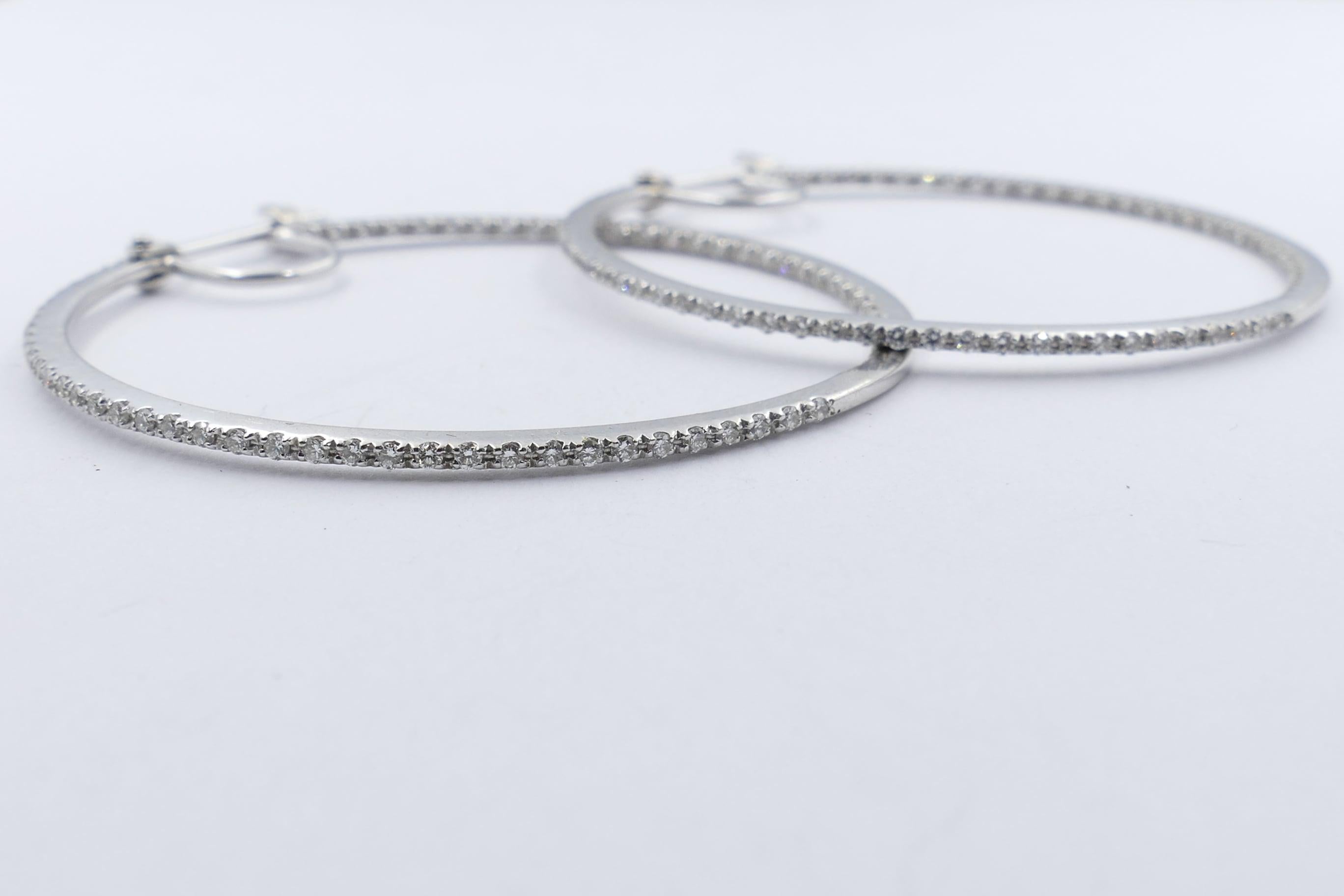 Purchased in London & set in 9ct White Gold these largeish Hoops would complement any outfit. Not at all heavy to look at but give a lovely sparkle.
There are 152 round brilliant cut Diamonds of good colour H/J, clarity SI1-SI2, totalling 3 quarters