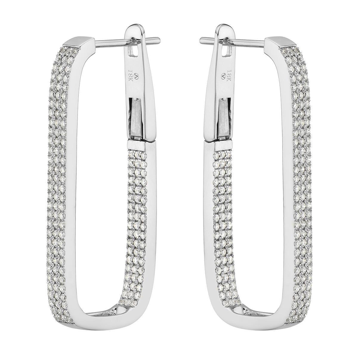 With these exquisite white gold diamond hoop earrings, style and glamour are in the spotlight. These hoop earrings are set in 18-karat gold and made from 10.1 grams of gold. The color of the diamonds is G. The clarity is VS2. These earrings are made