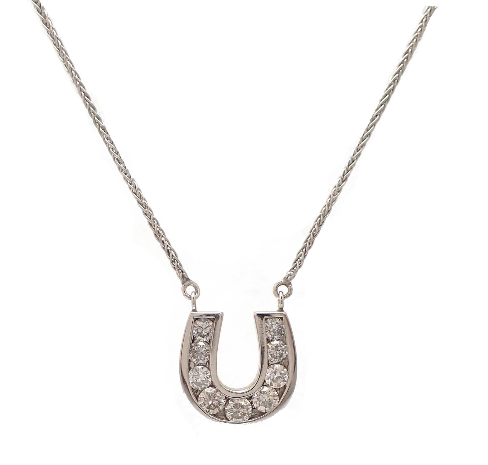 Bringing the horseshoe to the next level, this stunning pendant is perfect for the horse lover AND jewelry lover. This necklace, in 14K white gold, features 9 round brilliant diamonds weighing over one carat in total weight. The diamond horseshoe is