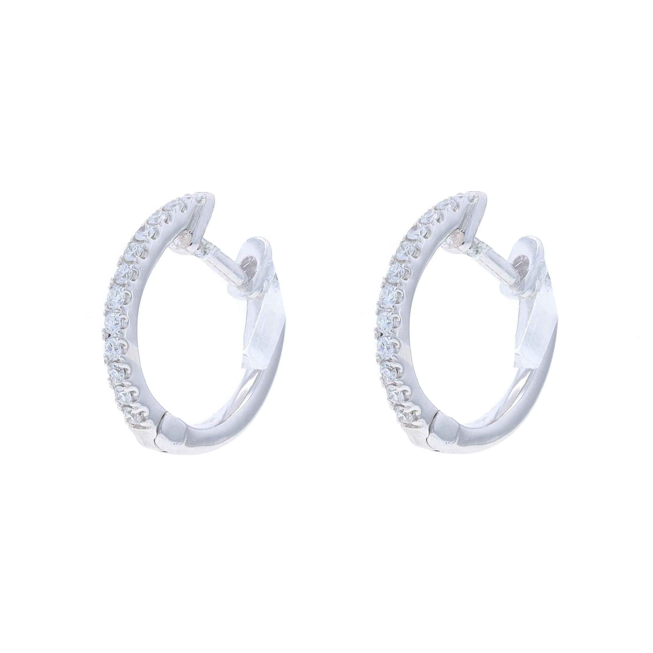 Metal Content: 14k White Gold

Stone Information

Natural Diamonds
Carat(s): .12ctw
Cut: Round Brilliant
Color: G
Clarity: VS2 - SI1

Total Carats: .12ctw

Style: Huggie Hoop
Fastening Type: Snap Closures
Features: French Set