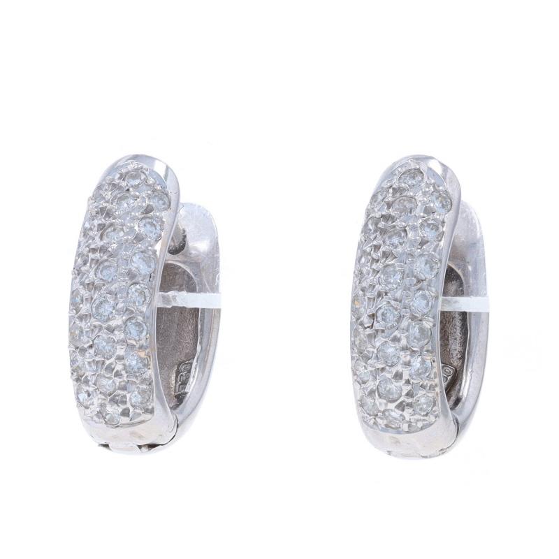 Metal Content: 18k White Gold

Stone Information

Natural Diamonds
Carat(s): .50ctw
Cut: Round Brilliant
Color: G - H
Clarity: SI2 - I1

Total Carats: .50ctw

Style: Huggie Hoop
Fastening Type: Snap Closures

Measurements

Tall: 5/8