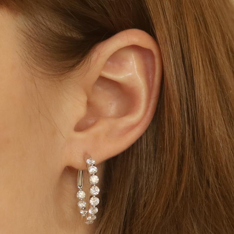 Metal Content: 18k White Gold

Stone Information
Natural Diamonds
Carat(s): 3.24ctw
Cut: Round Brilliant
Color: F - G
Clarity: VS1 - VS2

Total Carats: 3.24ctw

Style: Inside-Out Hoop
Fastening Type: Leverback Closures

Measurements
Tall: 1