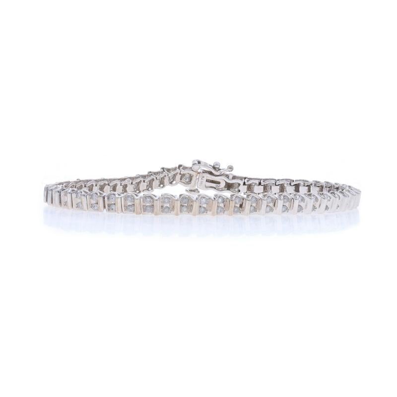 Metal Content: 10k White Gold

Stone Information

Natural Diamonds
Carat(s): 1.50ctw (carat stamp)
Cut: Round Brilliant
Color: G - H
Clarity: I2 - I3

Total Carats: 1.50ctw

Style: Link
Fastening Type: Tongue Box Clasp with One Side Safety