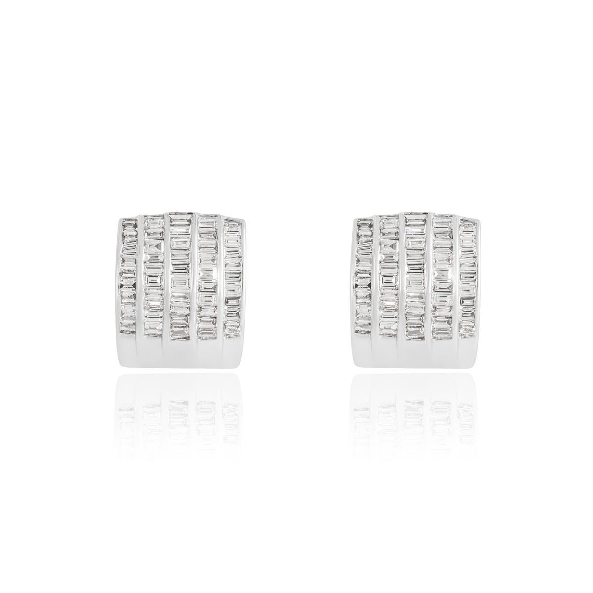 A gorgeous 18k white gold diamond pendant and earrings suite. The pendant features 5 columns channel set with 50 baguette cut diamonds and matching earrings that are each set with 48 baguette cut diamonds with a total weight of 3.70ct, G-H colour