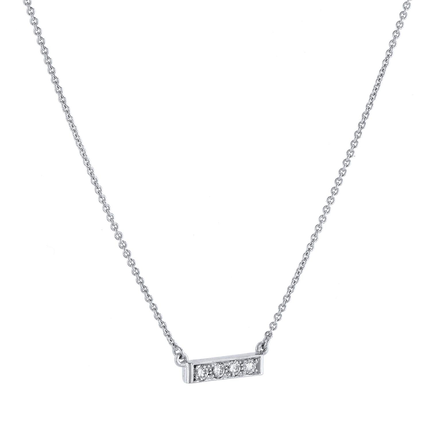 Raise the bar in your everyday look with this 18 karat white gold pendant adorned with pave set diamonds (0.09 carats in total weight, F/G VS).