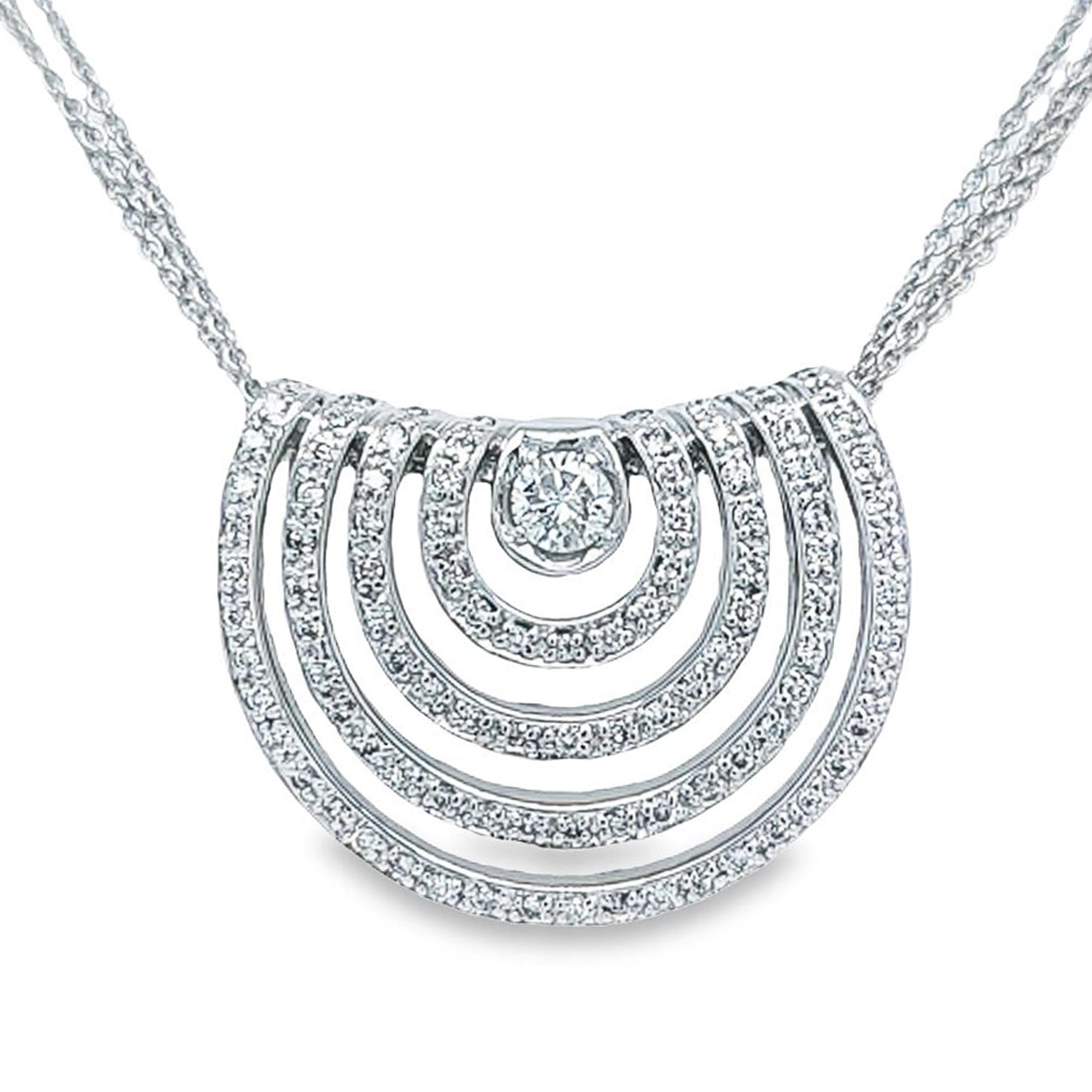 14 Karat White Gold Semi-Circle Pendant Necklace Featuring 100 Round Brilliant Cut Diamonds of SI Clarity and H Color Totaling Approximately 0.70 Carats. 16.5 Inch Triple Strand Chain with Lobster Clasp. Finished Weight is 12.5 Grams.