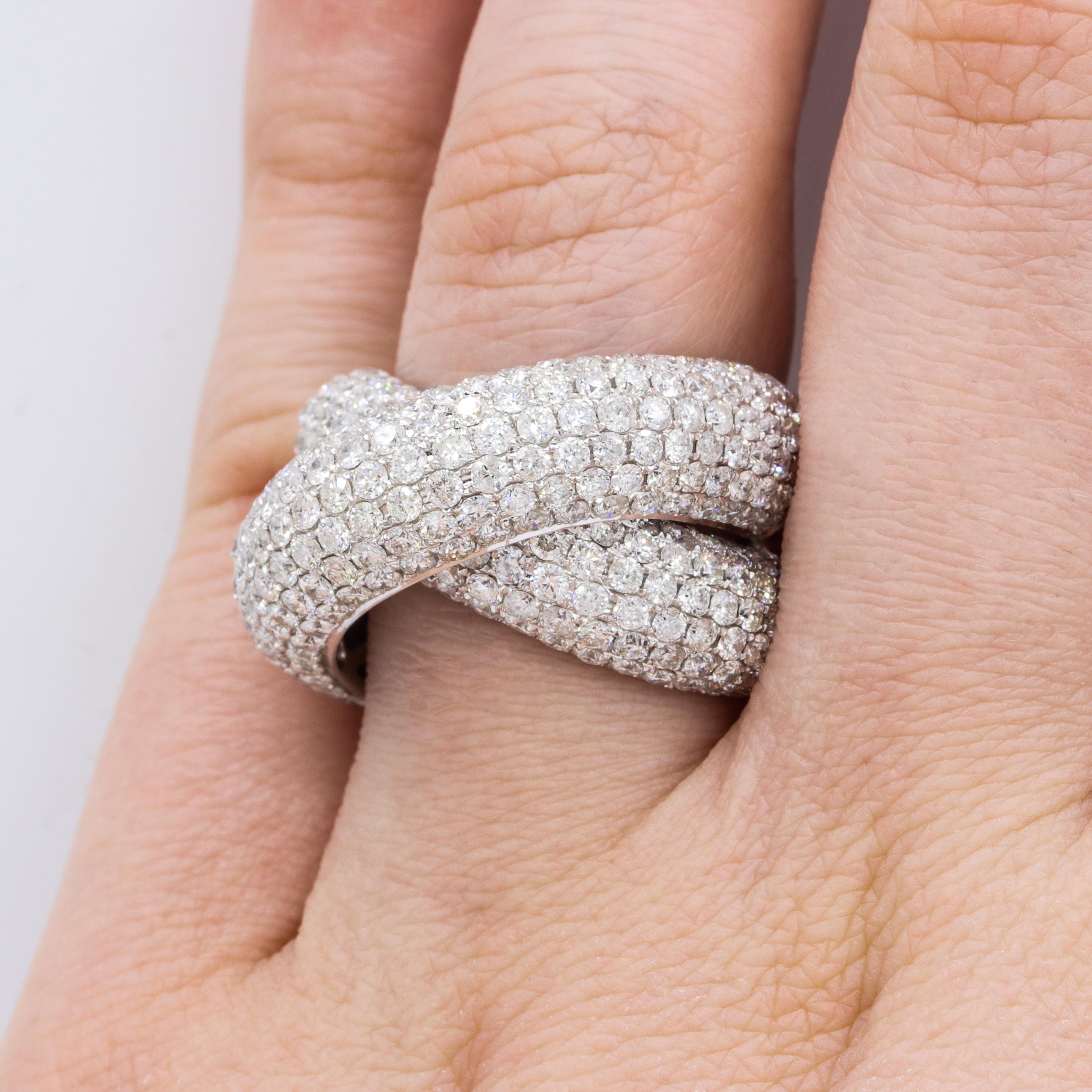 18W White Gold Puffy Criss Cross Ring features 4.87 carats of round diamonds.