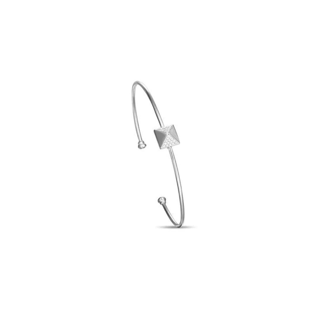 Stylish 14k white gold bangle. Bangle features a trendy pyramid element with pave set round brilliant diamonds. Perfect to wear on its own or stacked with other bangles. Diamonds are H-I color, SI clarity, total carat weight 0.13 ctw. One size fits