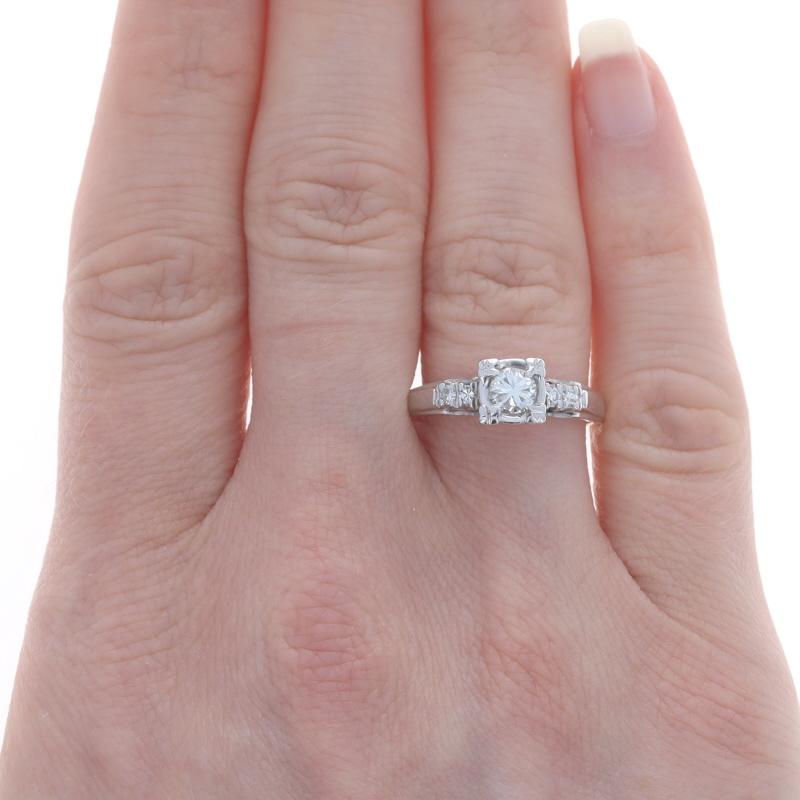Size: 8
Sizing Fee: Up 3 sizes for $35 or Down 3 sizes for $30

Era: Retro
Date: 1940s - 1950s

Metal Content: 14k White Gold

Stone Information
Natural Diamond
Carat(s): .35ct
Cut: Round Brilliant
Color: J
Clarity: VS1

Natural Diamonds
Carat(s):