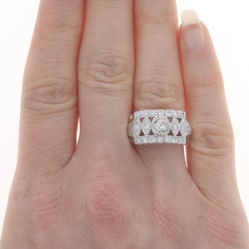 Size: 8
Sizing Fee: Up 2 1/2 sizes for $40 or Down 1 size for $30

Era: Retro
Date: 1940s - 1950s

Metal Content: 14k White Gold

Stone Information
Natural Diamond
Carat(s): .38ct
Cut: European
Color: K
Clarity: I1

Natural Diamonds
Carat(s):