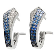 White gold diamond & sapphire earrings in round cut diamonds