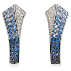 White gold diamond & sapphire earrings in round cut diamonds