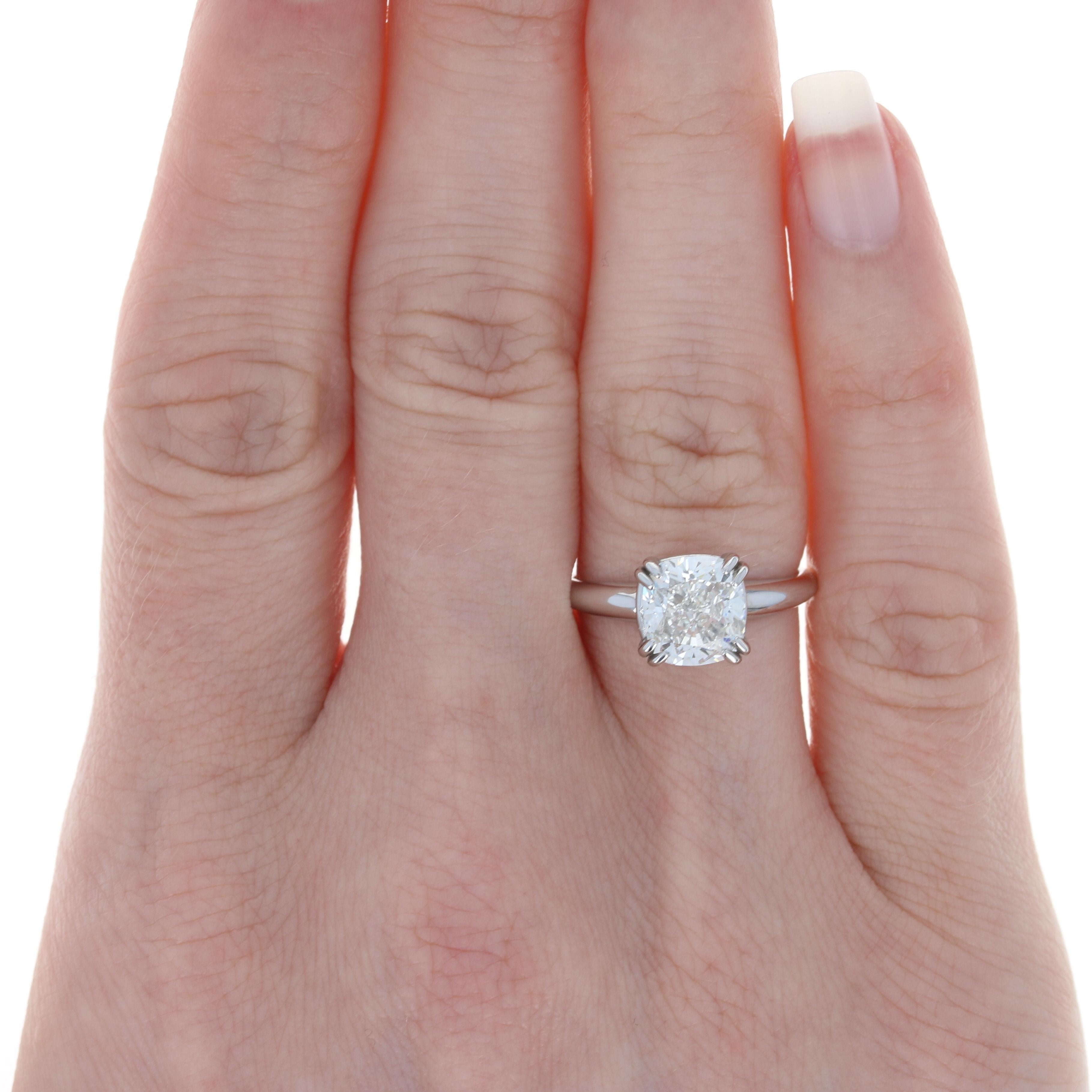 Size: 5 3/4 
Sizing Fee: Up or Down 2 sizes for $30 

Metal Content: 14k White Gold

Stone Information: 
Natural Diamond
Carat: 2.52ct
Cut: Cushion
Color: G
Clarity: VS1
Size (mm): 7.86 x 7.29 x 5.17 

Solitaire's GIA Report Number: