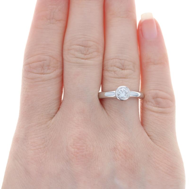 Size: 6 1/2
Sizing Fee: Down 2 for $35 or up 2 for $40

Metal Content: 14k White Gold

Stone Information
Natural Diamond
Carat: .45ct
Cut: Round Brilliant
Color: F
Clarity: I1

Style: Solitaire

Measurements

Face Height (north to south): 9/32