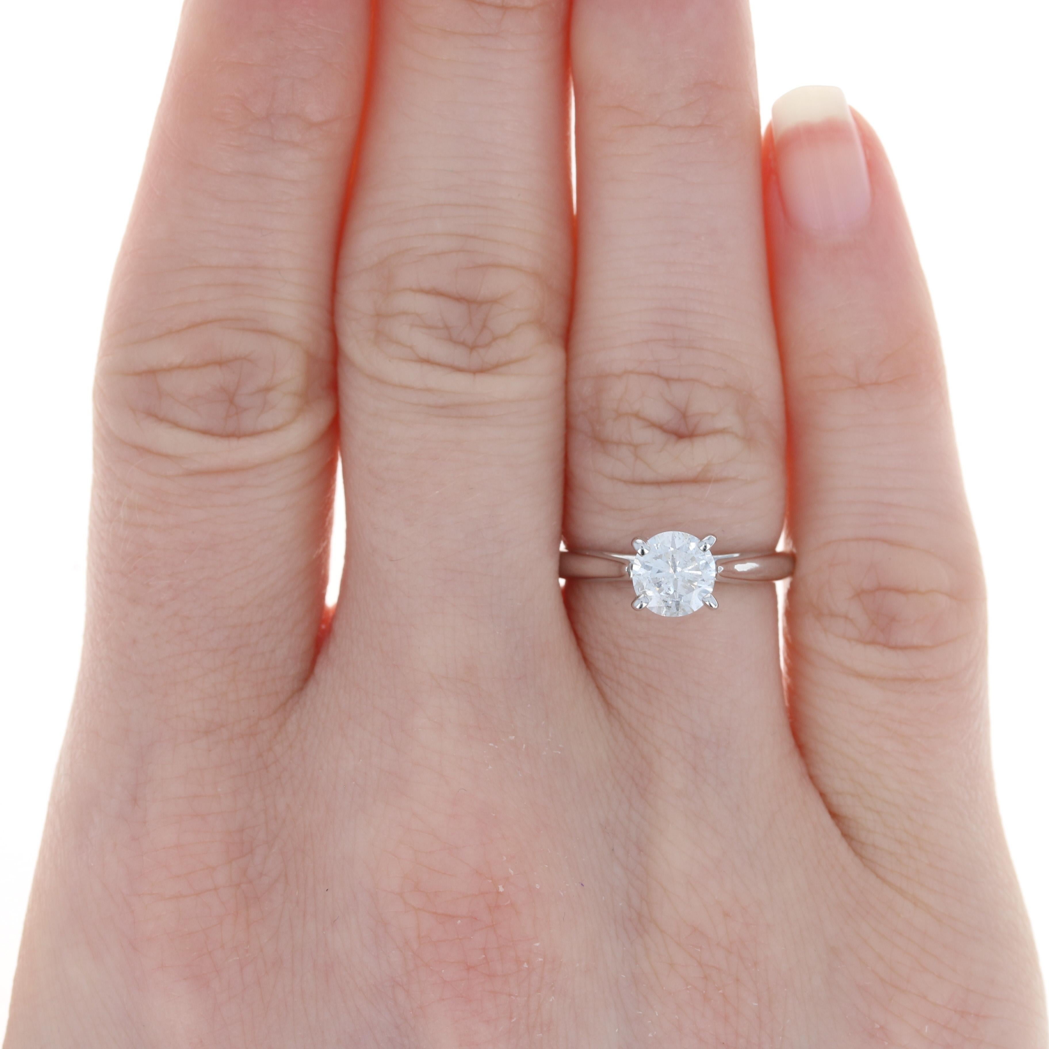 Size: 5 1/4
 Sizing Fee: Down 2 sizes for $20 or Up 2 sizes for $25
 
 Brand: Scott Kay
 
 Metal Content: 14k White Gold
 
 Stone Information: 
 Natural Diamond Solitaire
 Carat: .96ct (weighed)
 Cut: Round Brilliant
 Color: E
 Clarity: I2
 
