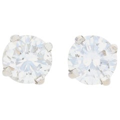 Clous d'oreilles en or blanc 14 carats avec diamants taille brillant rond de 0,60 carat percés