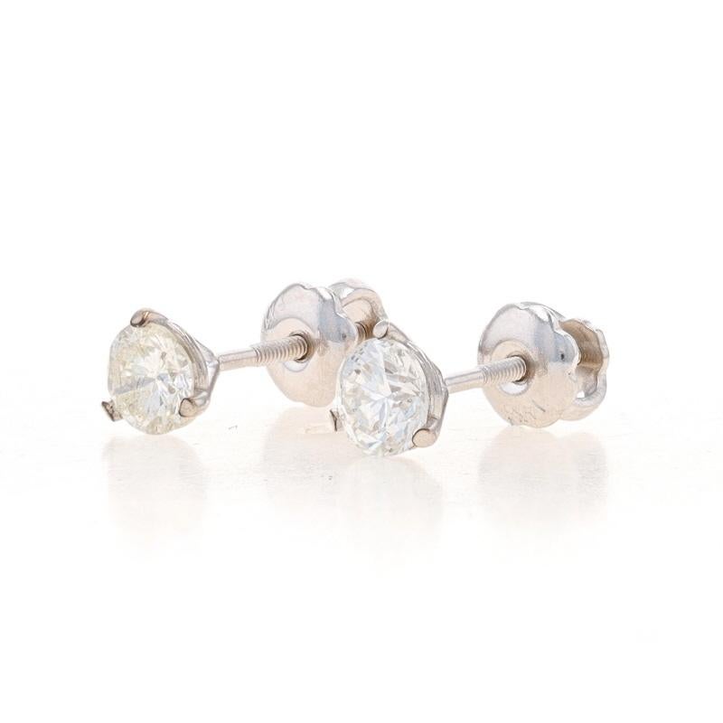 Metal Content: 14k White Gold

Stone Information
Natural Diamonds
Carat(s): .50ctw
Cut: Round Brilliant
Color: I - J
Clarity: SI2

Total Carats: .50ctw

Style: Stud
Fastening Type: Pierced Screw-On Closures

Measurements
Tall: 3/16