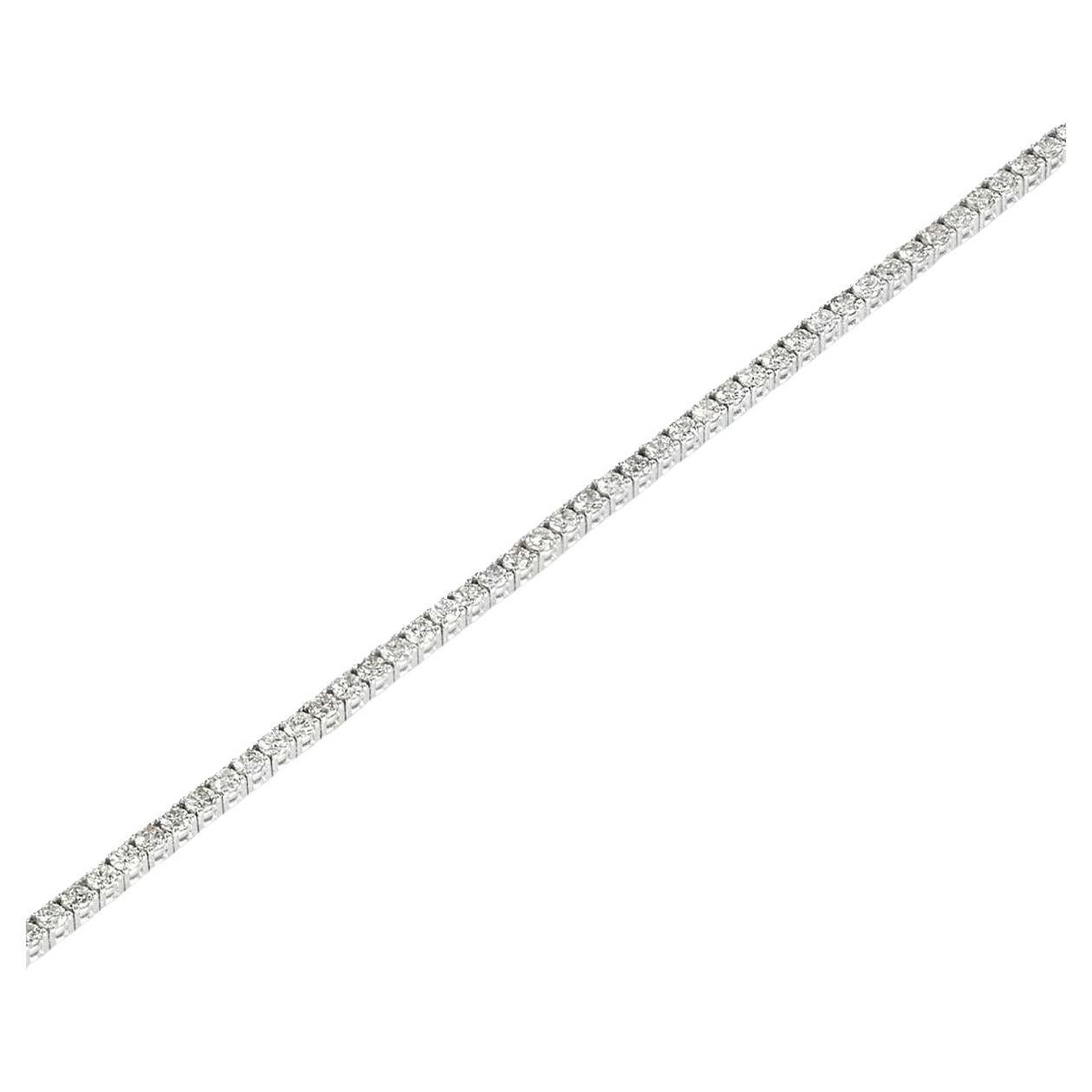 A stunning 18k white gold diamond tennis bracelet. The line bracelet features 94 round brilliant cut diamonds in a four prong setting with a total weight of 2.03ct, G-H colour and SI clarity. The bracelet measures 7 inches in length and 2mm in