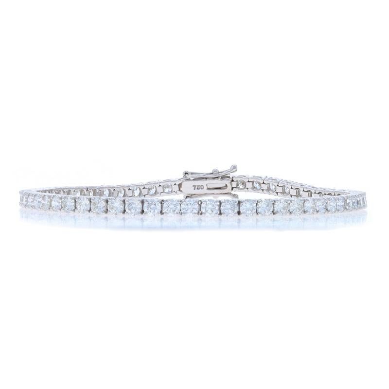 Metal Content: 18k White Gold

Stone Information

Natural Diamonds
Carat(s): 6.01ctw
Cut: Round Brilliant
Color: F - G
Clarity: VS1 - VS2

Total Carats: 6.01ctw

Style: Tennis
Fastening Type: Tab Box Clasp with Two Side Safety