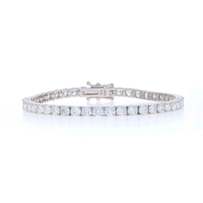 Metal Content: 18k White Gold

Stone Information

Natural Diamonds
Carat(s): 7.80ctw (carat stamp)
Cut: Round Brilliant
Color: F - G
Clarity: VS1 - VS2

Total Carats: 7.80ctw

Style: Tennis
Fastening Type: Tab Box Clasp with Two Side Safety