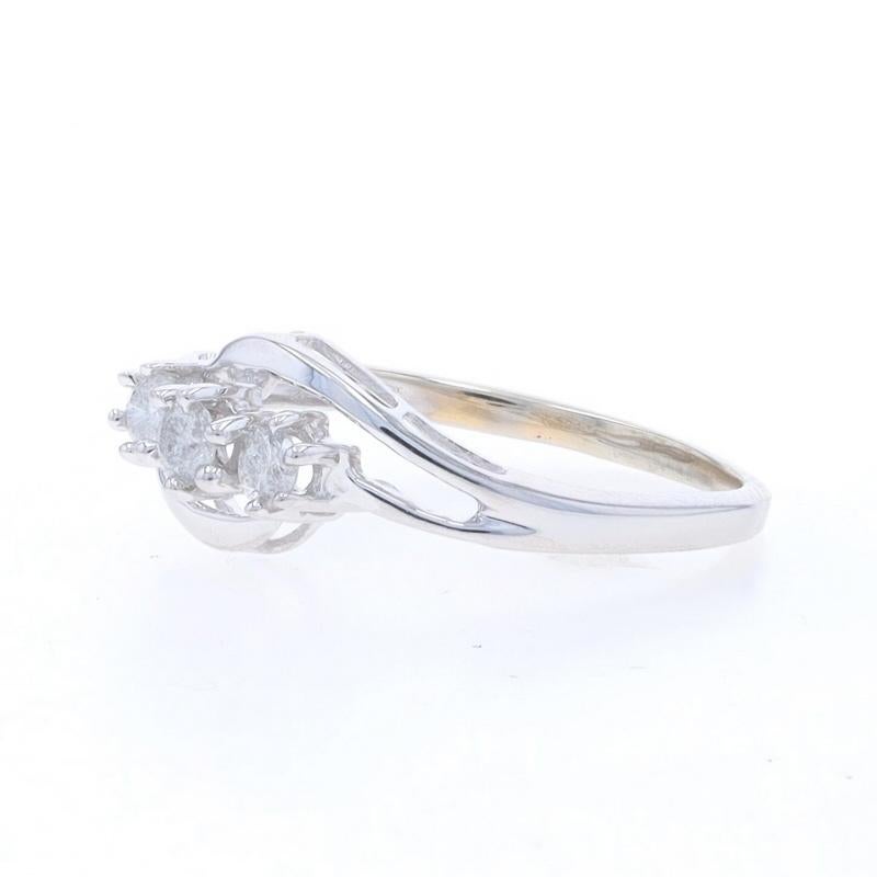 White Gold Diamond Three-Stone Bypass Ring - 10k Round Brilliant .25ctw In Excellent Condition For Sale In Greensboro, NC