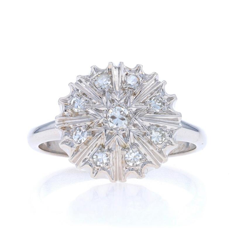 Size: 6 1/4
Sizing Fee: Up 3 sizes for $40 or Down 2 sizes for $30

Era: Vintage

Metal Content: 14k White Gold

Stone Information

Natural Diamonds
Carat(s): .25ctw
Cut: Round Brilliant (center) & Single
Color: I - J
Clarity: SI2 / VS1 - VS2

Total