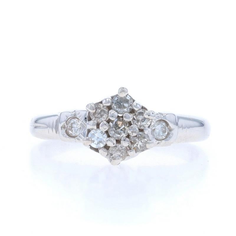 Size: 2 1/4
Sizing Fee: Up 2 sizes for $40

Era: Vintage

Metal Content: 10k White Gold

Stone Information

Natural Diamonds
Carat(s): .20ctw
Cut: Single and Round Brilliant
Color: H - I
Clarity: SI1 - I1

Total Carats: .20ctw

Style: Cluster with