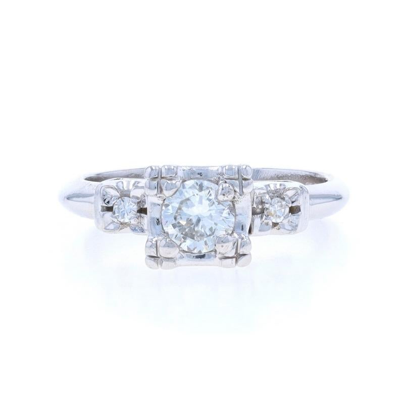 Size: 3 1/2
Sizing Fee: Up 3 sizes for $40 or Down 1/2 a size for $40

Era: Vintage

Metal Content: 14k White Gold

Stone Information

Natural Diamond
Carat(s): .33ct
Cut: Round Brilliant
Color: I
Clarity: SI2

Natural Diamonds
Carat(s): .04ctw
Cut: