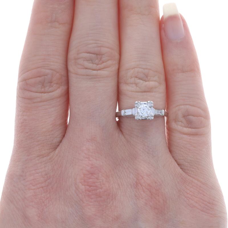 White Gold Diamond Vintage Engagement Ring 14k Round Brilliant .63ctw

Stone Information:
Natural Diamond
Carat(s): .33ct
Cut: Round Brilliant
Color: G
Clarity: VS1

Natural Diamonds
Carat(s): .30ctw
Cut: Baguette
Color: G - H
Clarity: VS1 -