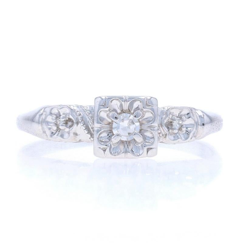 Size: 6 1/2
Sizing Fee: Up 2 sizes for $40 or Down 1 size for $40

Era: Vintage

Metal Content: 14k White Gold

Stone Information

Natural Diamonds
Carat(s): .06ctw
Cut: Single
Color: G - H
Clarity: VS1 - VS2

Style: Solitaire with
