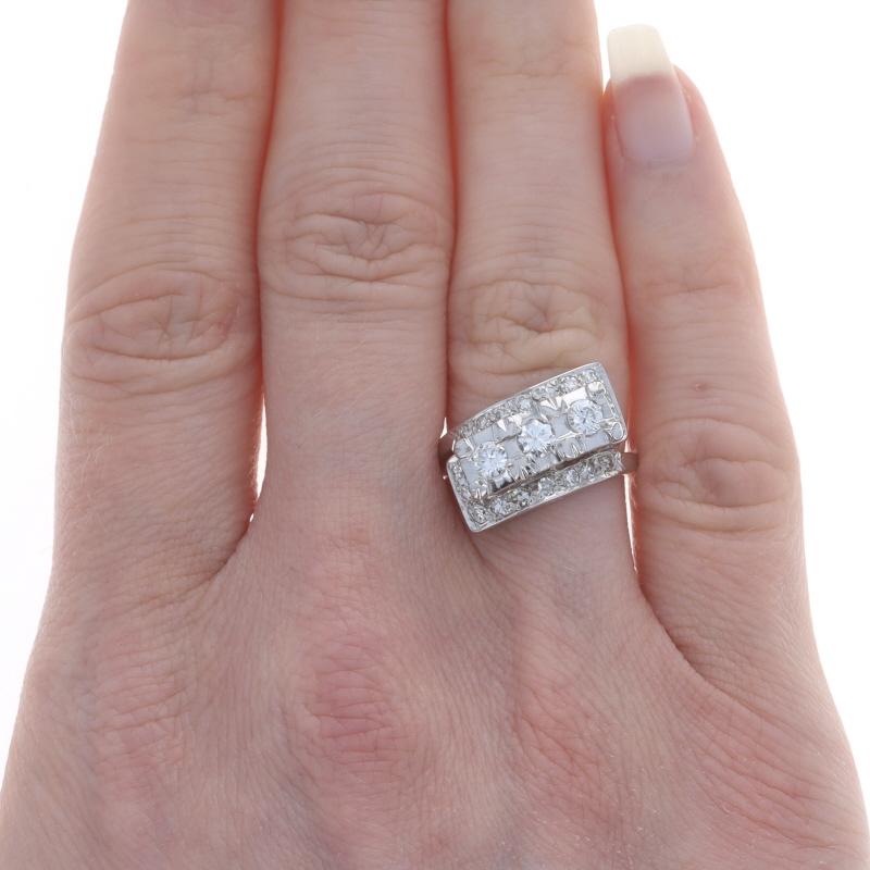 Size: 5 1/4
Sizing Fee: Up 2 sizes for $35 or Down 1 size for $35

Era: Vintage

Metal Content: 14k White Gold

Stone Information
Natural Diamonds
Carat(s): .88ctw
Cut: Round Brilliant & Single
Color: F - G
Clarity: SI1 - SI2

Total Carats: