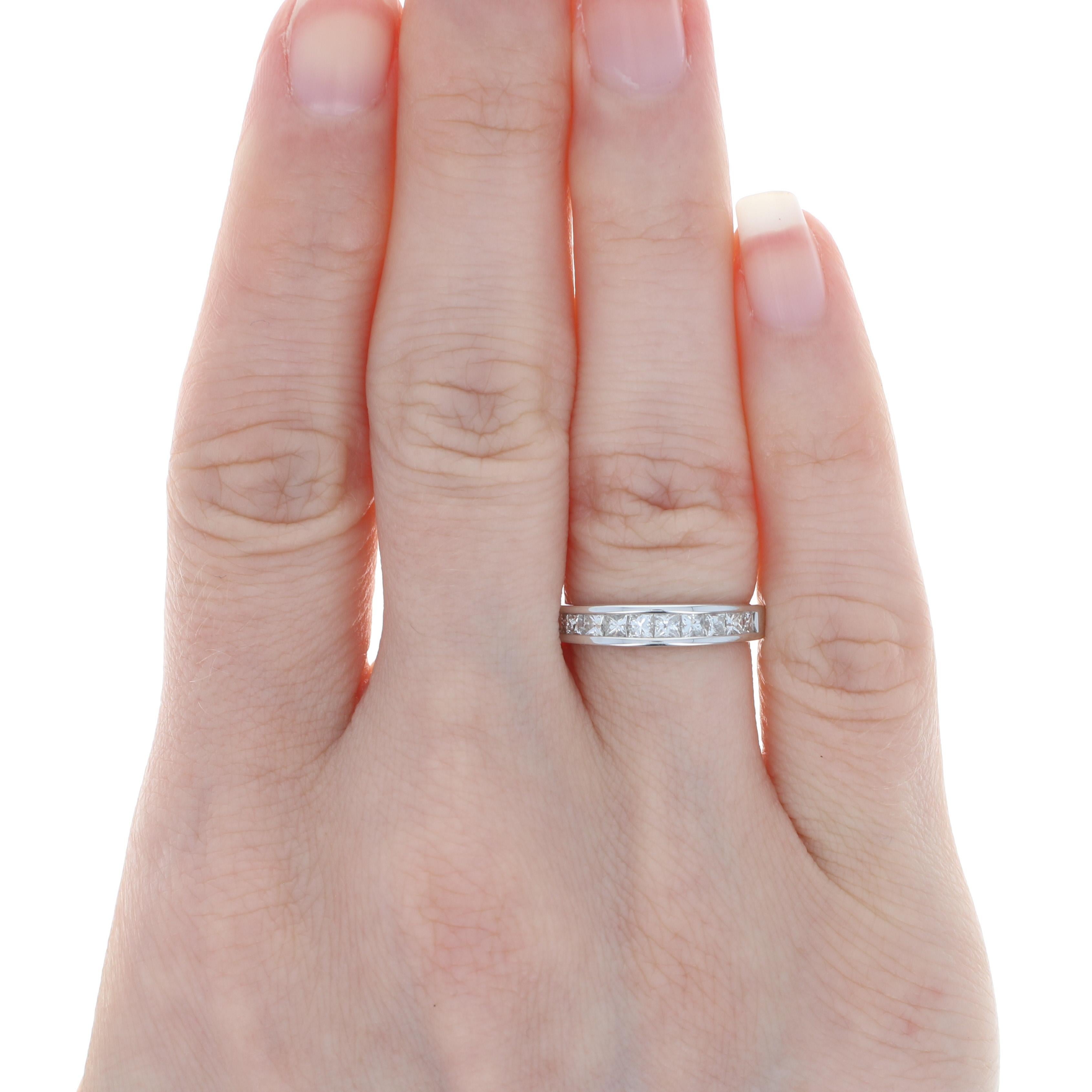 Whether it is worn solo or paired with her engagement piece, this dazzling wedding band is sure to delight your bride for a lifetime! Ten princess cut diamonds are set across the ported 14k white gold band that allows light to stream through the