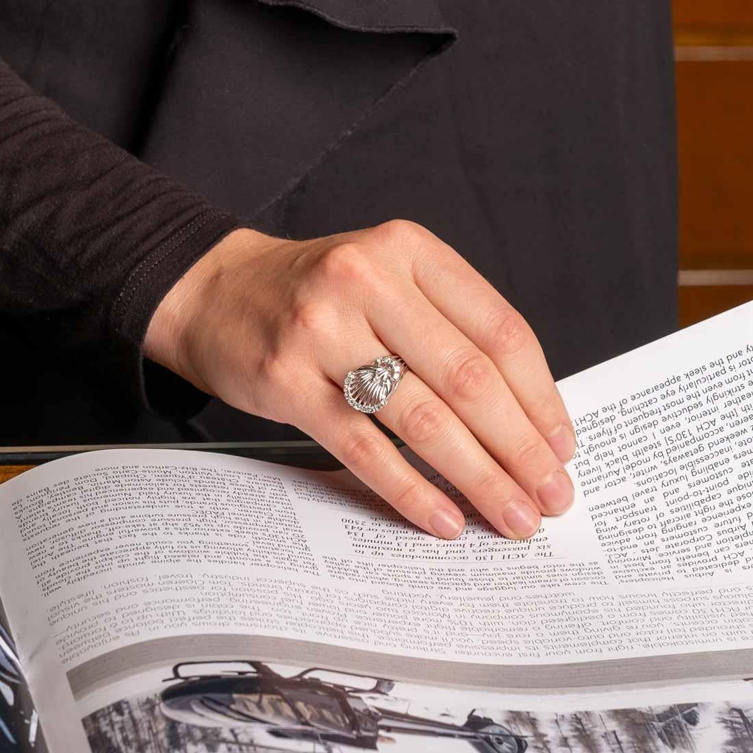 Ring in 18ct white gold with 8x8 cut diamonds for a total of 0.5ct circa. The design of the ring reflects the 1960s period as it was typical to see these linear shapes in the jewellery.

Italian ring size: 11.5
Measurements: H 1.6 x W 2.3
Weight: