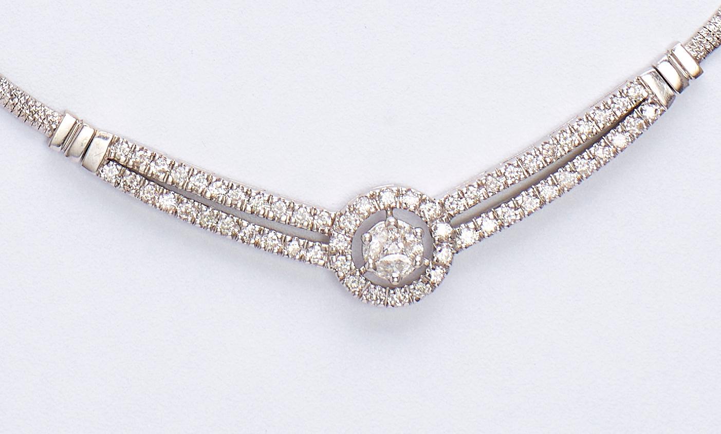 White Gold Diamonds Necklace 

Amazing design with 3.10 carat diamonds, marquise and round cut.
A nice round shape set with marquise and 2 rows of diamonds transforming to one.

Total Weight: 20 grams.