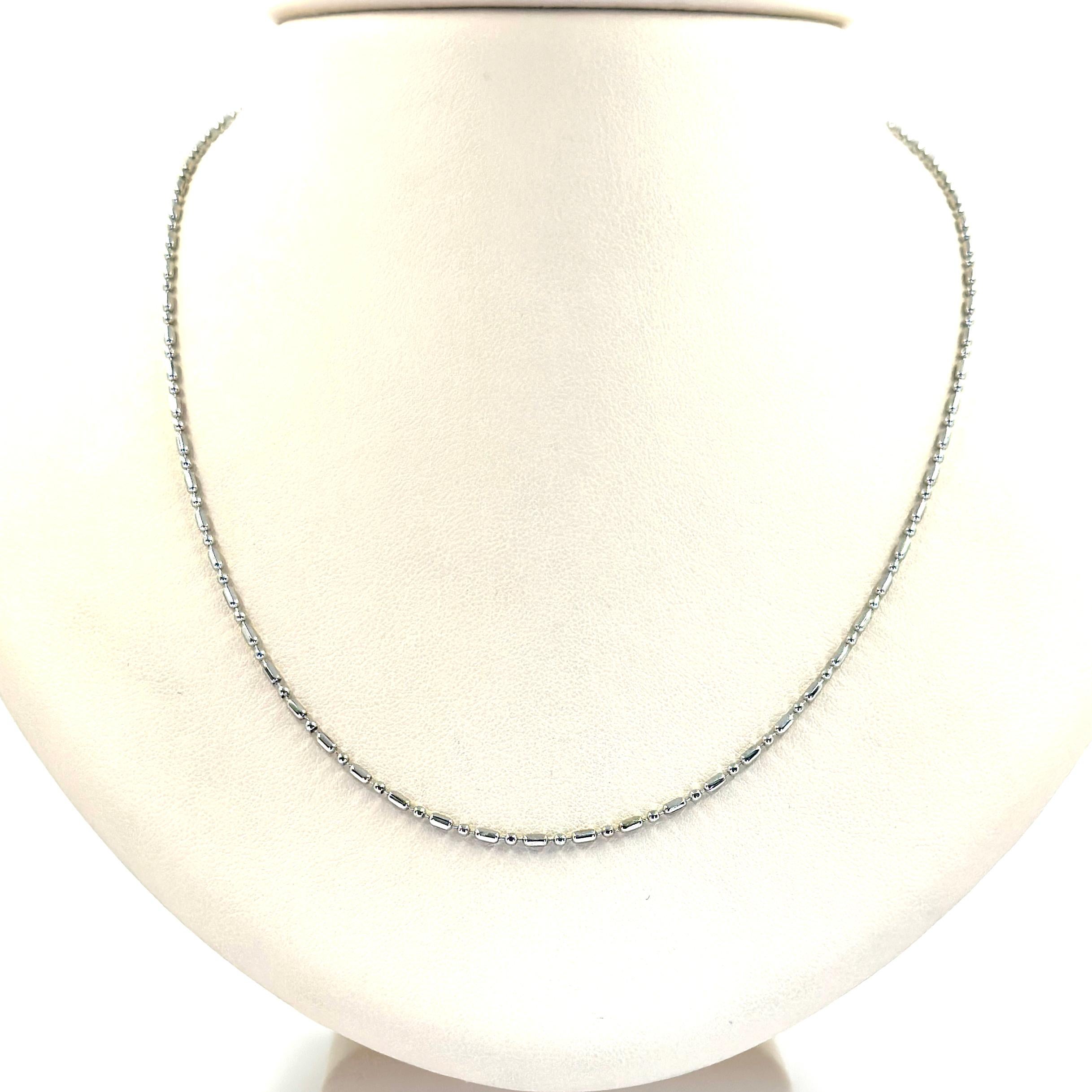 18 Karat White Gold Dot Dash Chain Measuring 19.5 Inches Long. Finished Weight is 4.2 Grams.