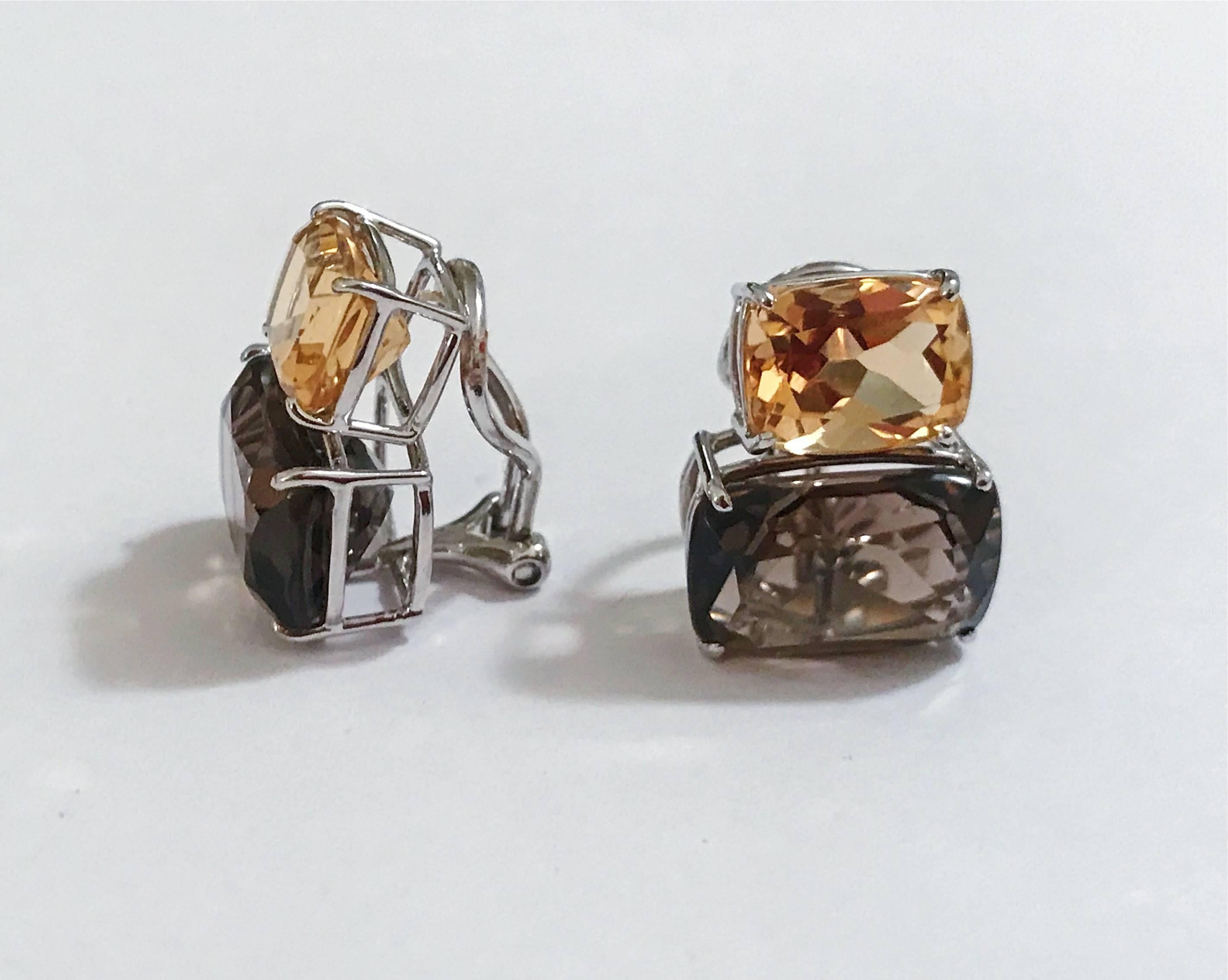 Elegant 18kt White Gold Double Cushion Earrings with Faceted Citrine and Smokey Topaz.

This is a classic day to evening earring that can be made clip or pierced. The meaning measures 3/4' tall and 1/2