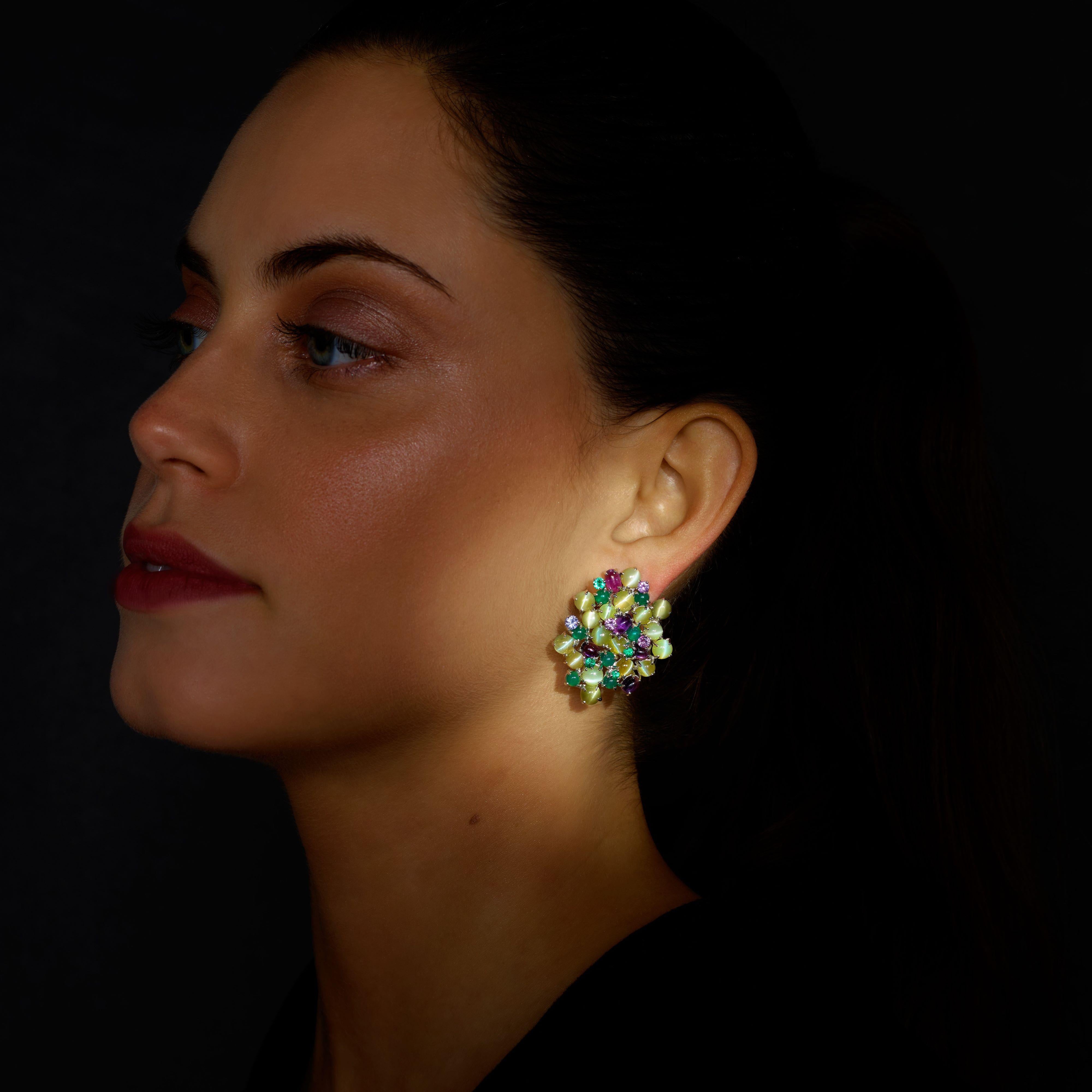 Rosior One-off Drop Earrings made in 19.2K White Gold and set with:
- 35 Crysoberyls weighing 24,91 ct, 
- 12 Agates weighing 3,26 ct, 
- 10 Amethysts weighing 4,09 ct,
- 8 Purple Sapphires weighing 1,24 ct 
- 7 Emeralds weighing 0,52 ct.
Weight in