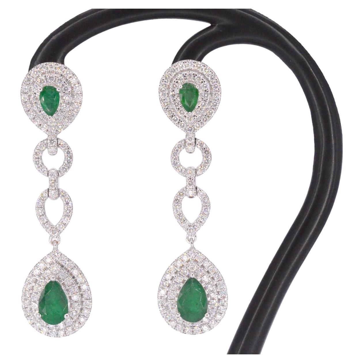White gold earrings with diamonds and emeralds