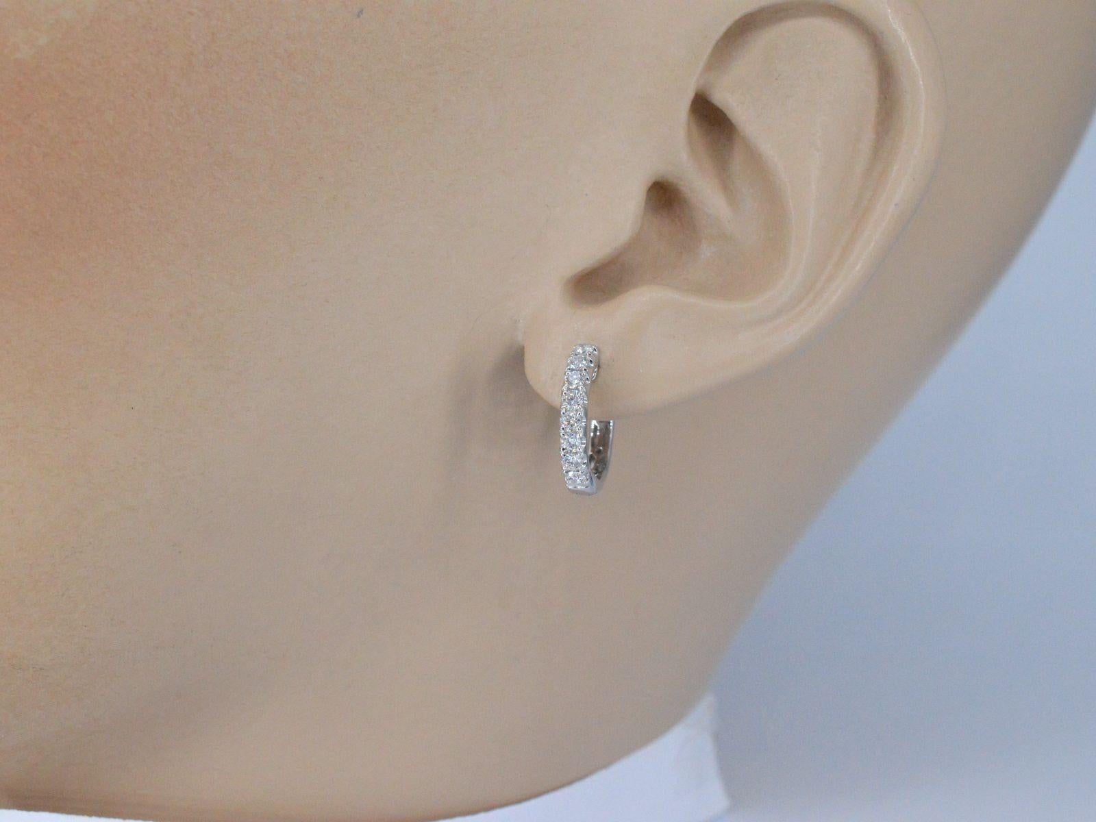 Introducing our stunning white gold earrings with naturally shiny beautiful diamonds, weighing 0.60 carats. The brilliant cut diamonds boast an amazing F-G color and VS clarity, making them truly exceptional. Made from high-quality 18K gold and