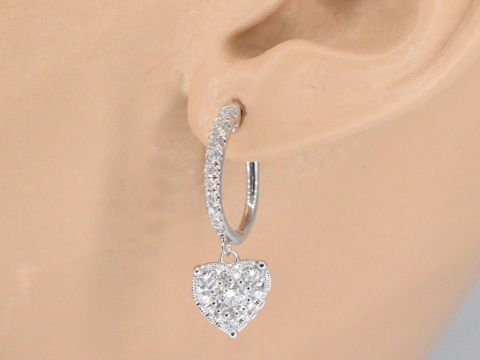 

Diamonds
Weight: 1.20 carat
Cut: Brilliant cut
Colour: F-G
Clarity: SI-P
Quality: Very good

Jewel: Earrings
Weight: 3.2 gram
Diameter: 25 mm
Hallmark: 14 karat 
Condition: New

Retail value: € 2.850

