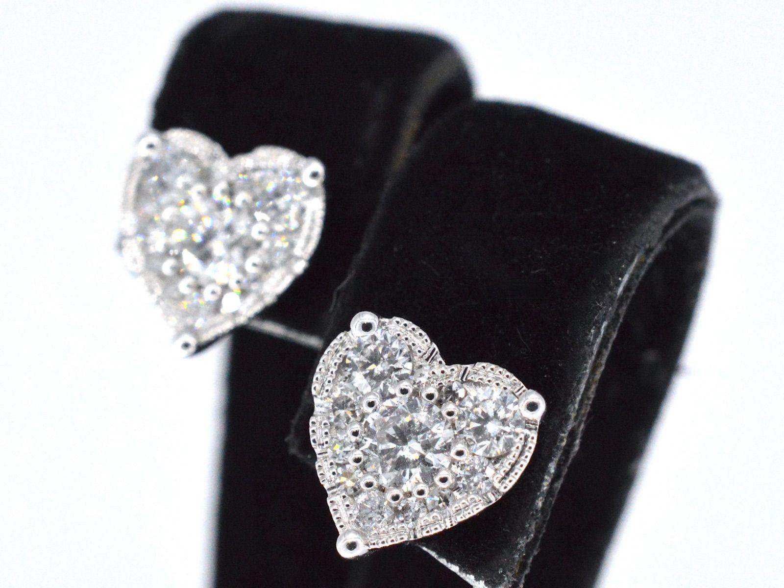 White gold earrings with brilliant cut diamonds in a heart-shape are a beautiful and romantic piece of jewelry that symbolizes love and affection. The heart-shaped design adds a touch of sentimentality to the earrings, making them an ideal gift for