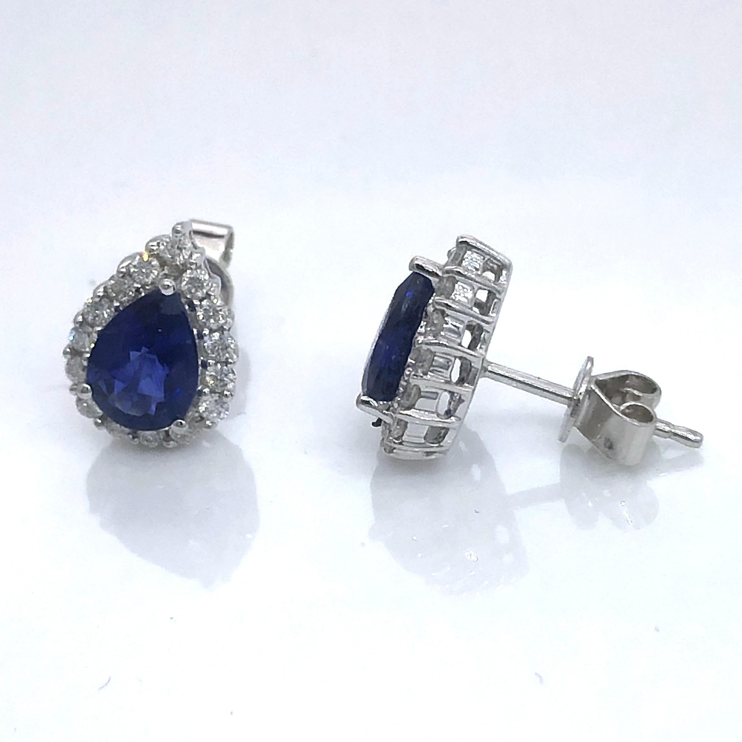Women's White gold earrings with pear shape Ceylon sapphires surrounded by diamonds For Sale