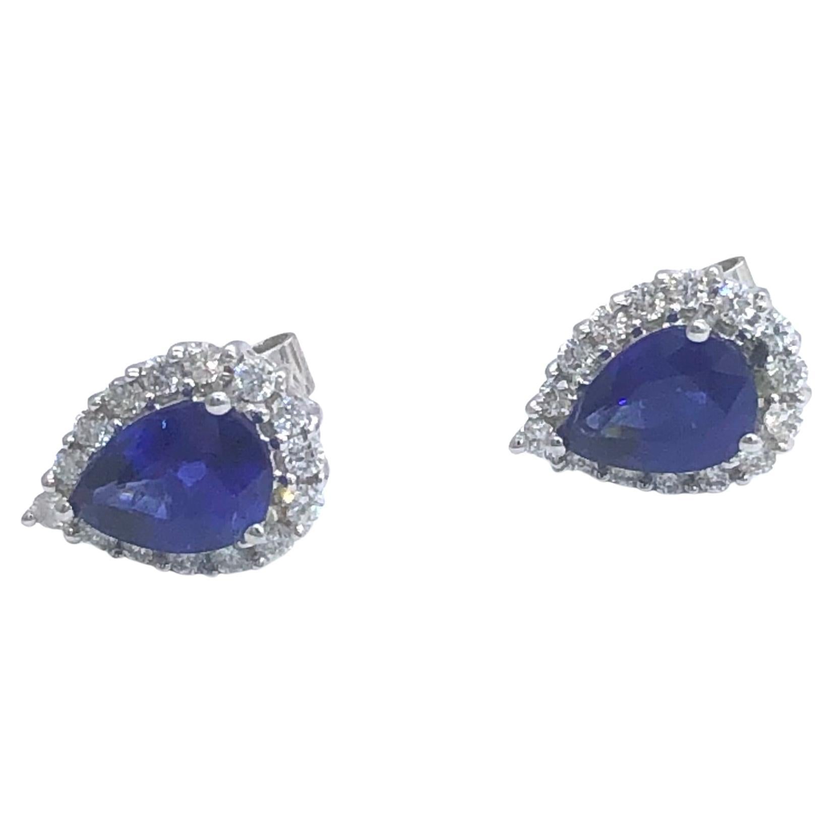 White gold earrings with pear shape Ceylon sapphires surrounded by diamonds For Sale