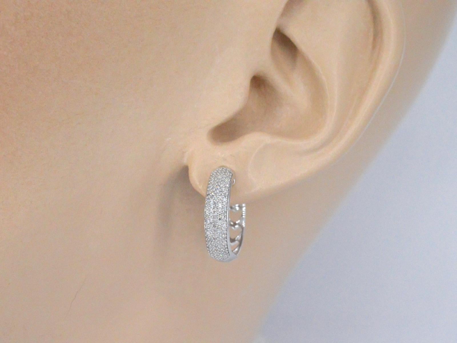 14K white gold earrings with real diamonds are a beautiful and high-quality piece of jewelry that combines the durability of 14K white gold with the beauty of real diamonds. The diamonds are expertly cut to maximize their sparkle and brilliance,