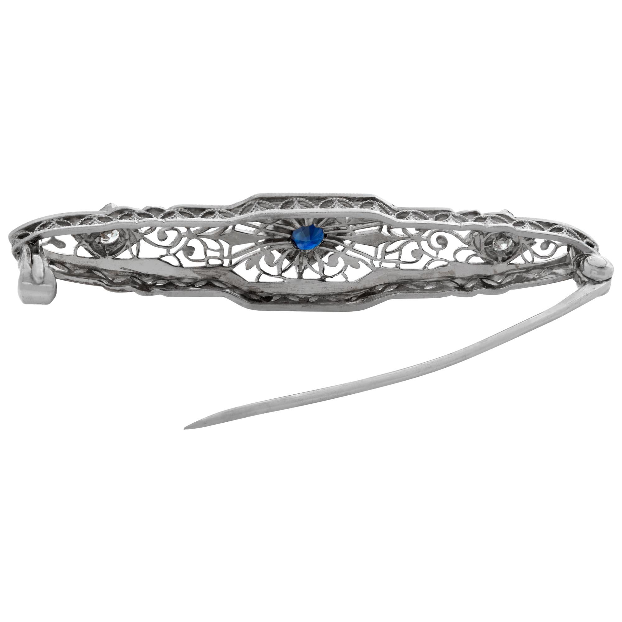 Women's White gold Edwardian pin with center sapphire and 2 side accent diamonds For Sale