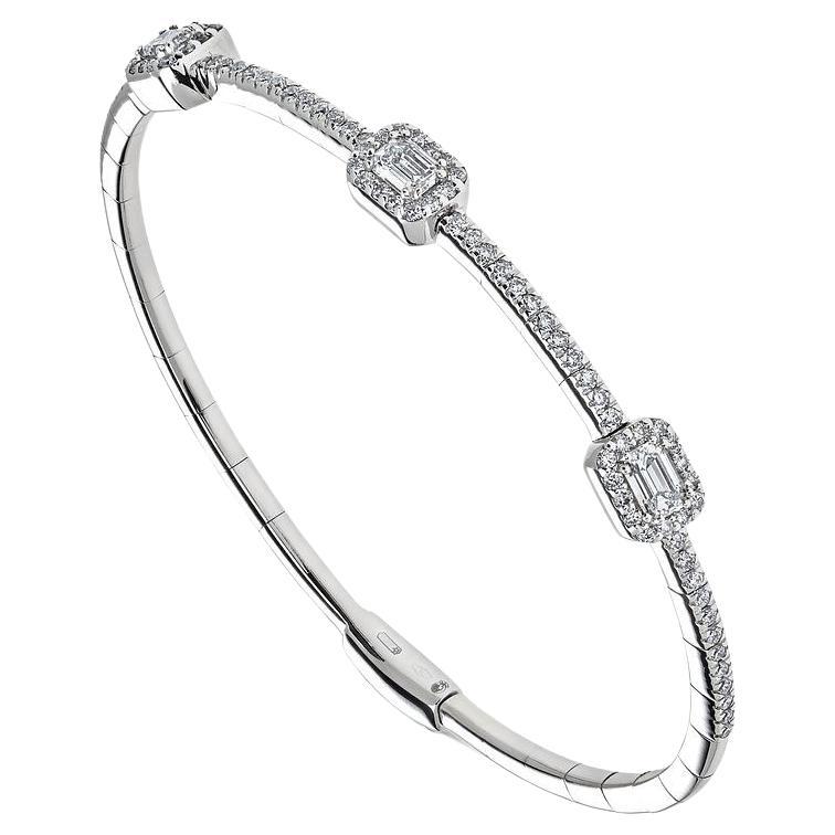 Indulge in the timeless allure of our White Gold Emerald Cut Diamond Bangle, a captivating masterpiece designed to adorn your wrist with elegance and sophistication.

Crafted from lustrous 18-karat white gold, this exquisite bangle exudes luxury and