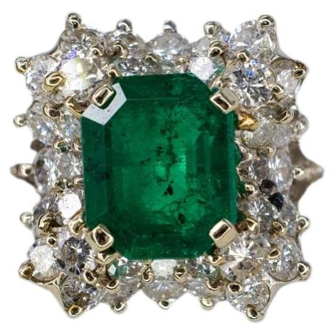 White Gold Emerald-Cut Emerald and Tiered Diamond Halo Cluster Ring