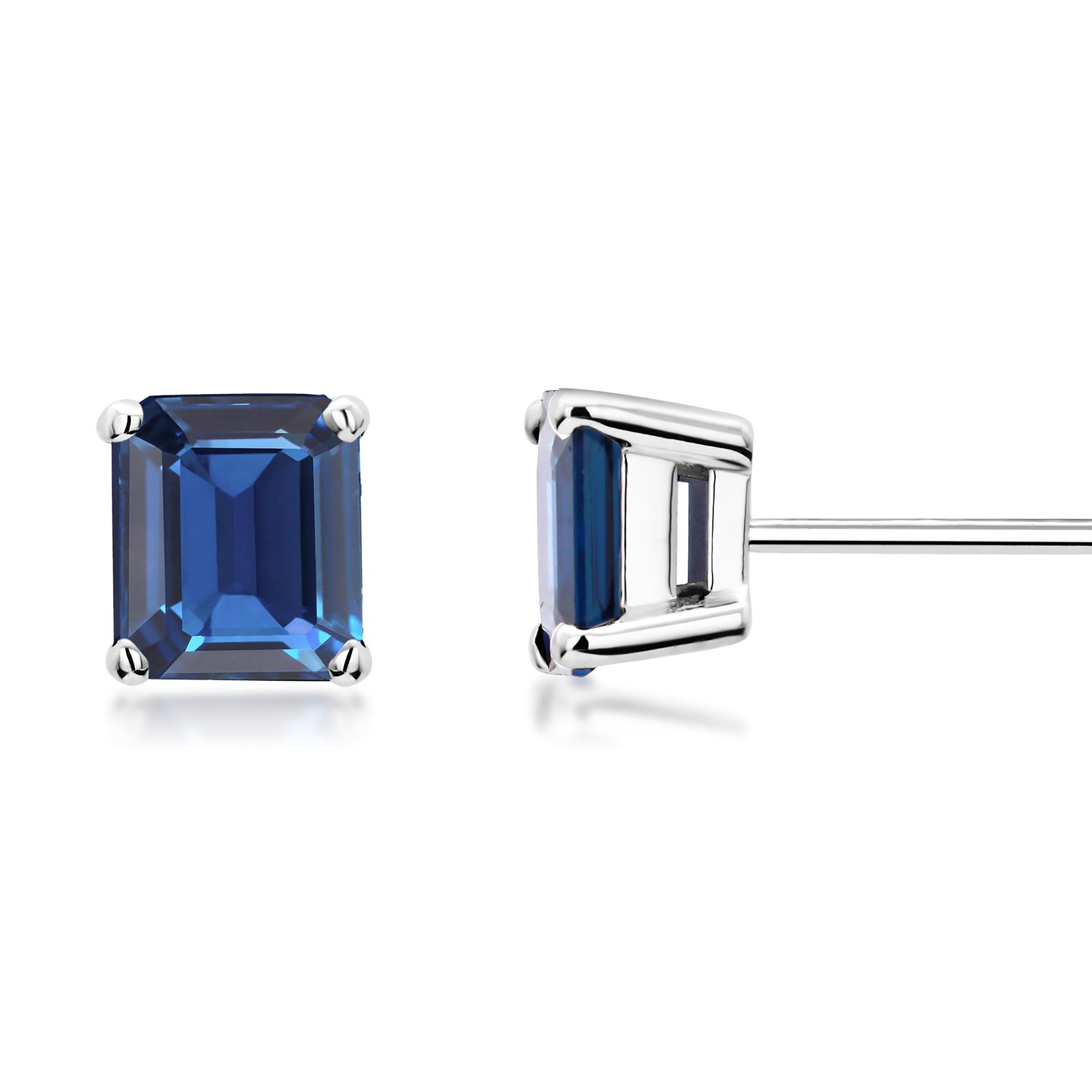 14 karats white gold 6-millimeter sapphire stud earrings 
Emerald-Cut sapphires weighing 1.61 carats
Width of the earrings 6.5 millimeter 
New Earrings
Handmade in the USA
The 14 karat gold earrings are hanging off a post with push-backs
Our design