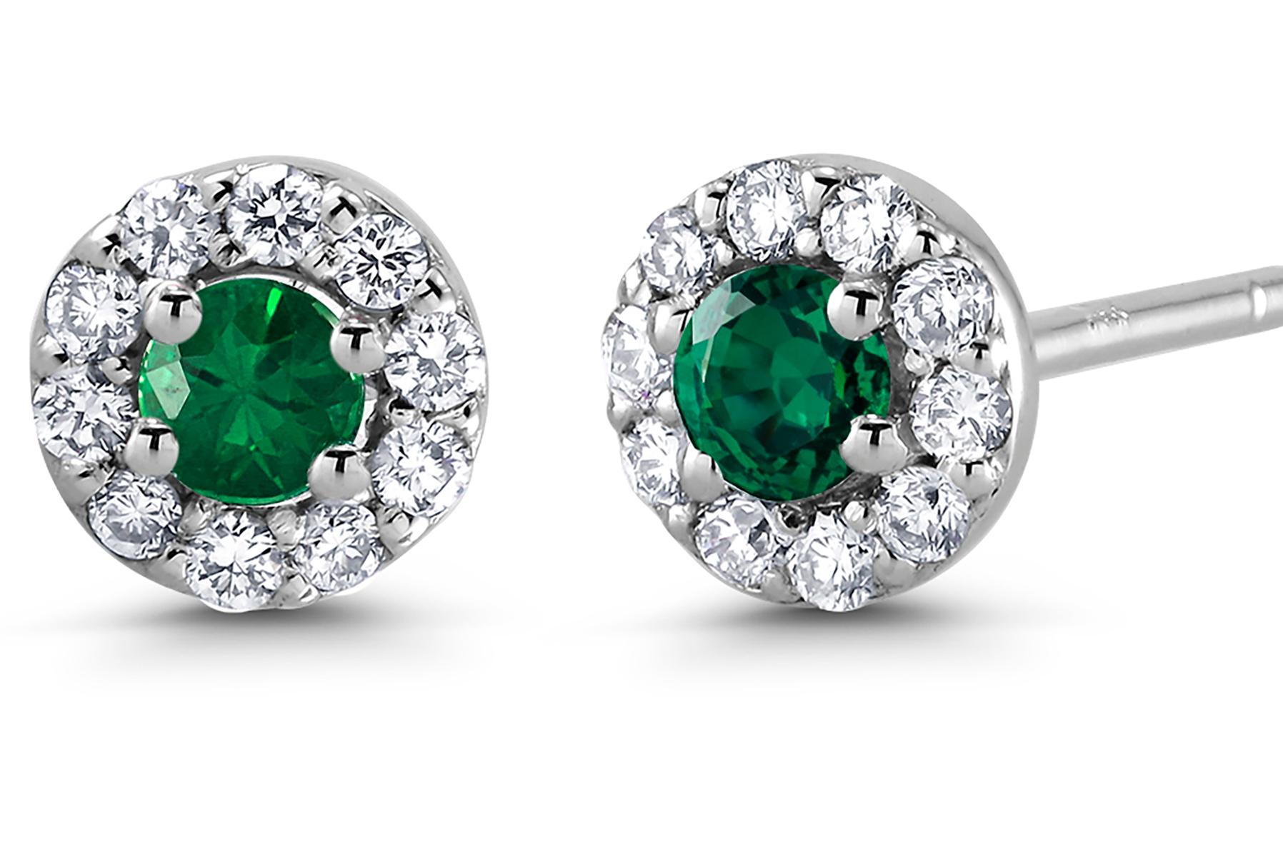 14 karat white gold halo emerald and diamond earrings 
Emerald weight 0.20 
Diamond weighing 0.27 carat
New Earrings
Width 0.25 inch
Emerald hue tone color deep forest green 
The halo setting is a setting that encircles any shaped gemstone with tiny